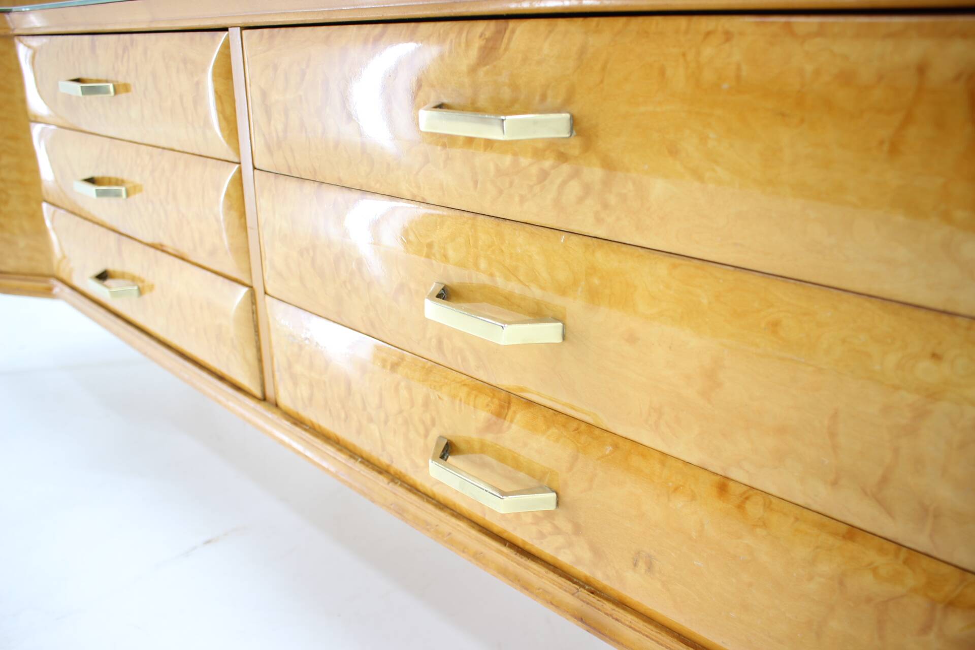 1960s italian sideboard/chest of drawers in high gloss finish with glass top and shelf