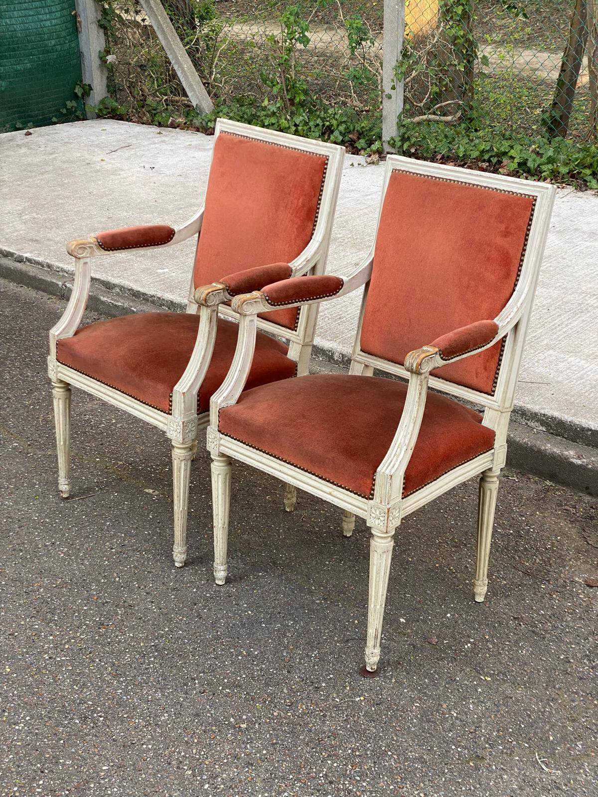2 Louis XVI armchairs in solid wood and orange velvet.