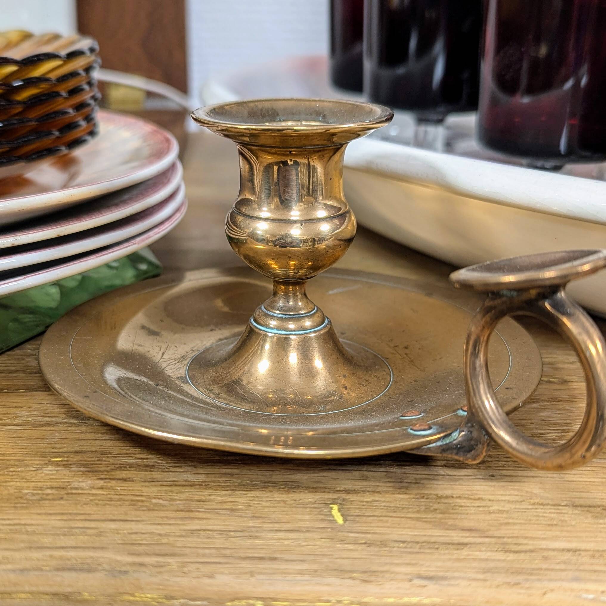 Brass thumb candle holder
