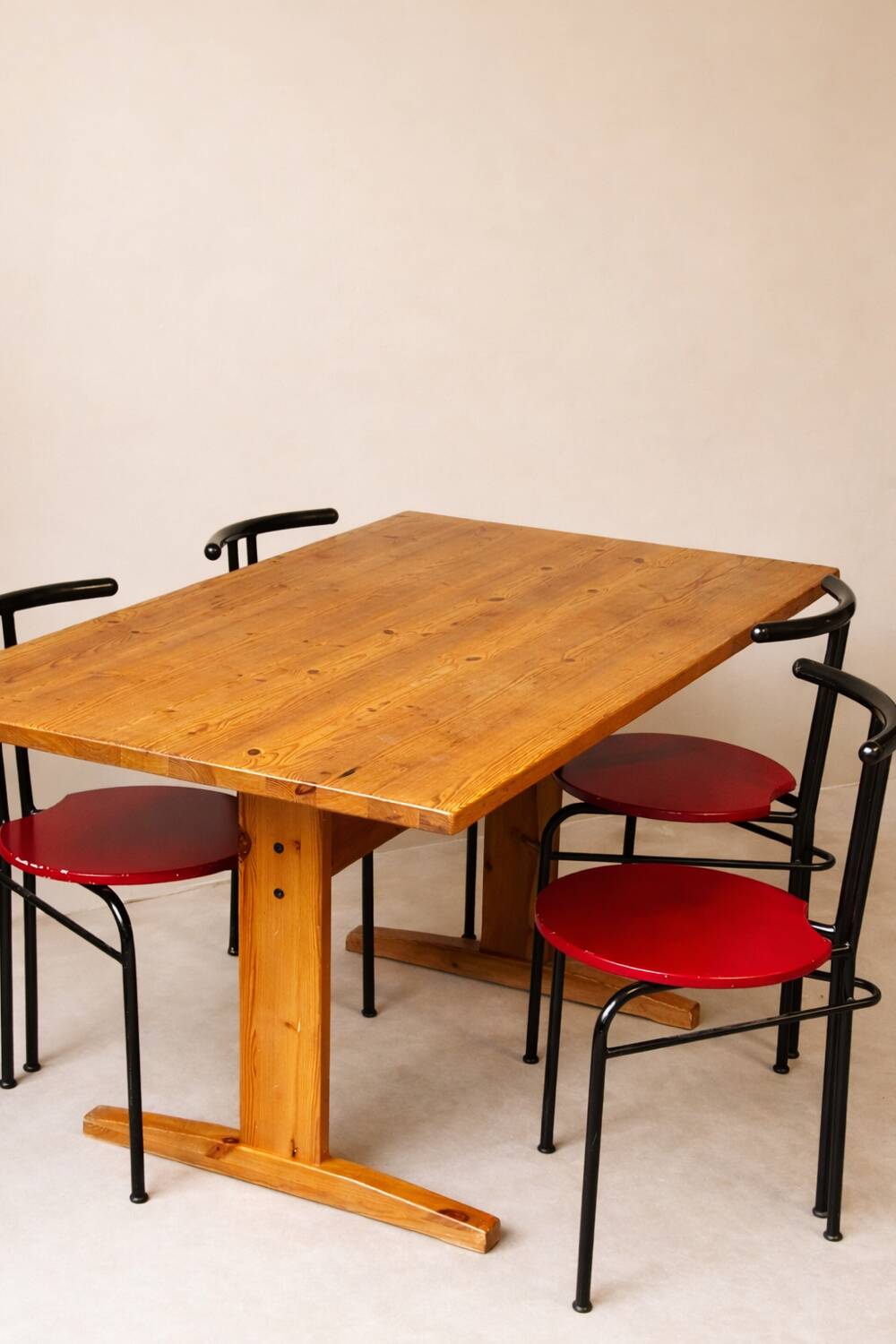 Set of 4 vintage black metal chairs with red lacquered seats.