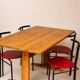 Set of 4 vintage black metal chairs with red lacquered seats.