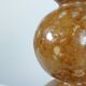 Unique vintage ceramic vase in the shape of a decorative sphere.
