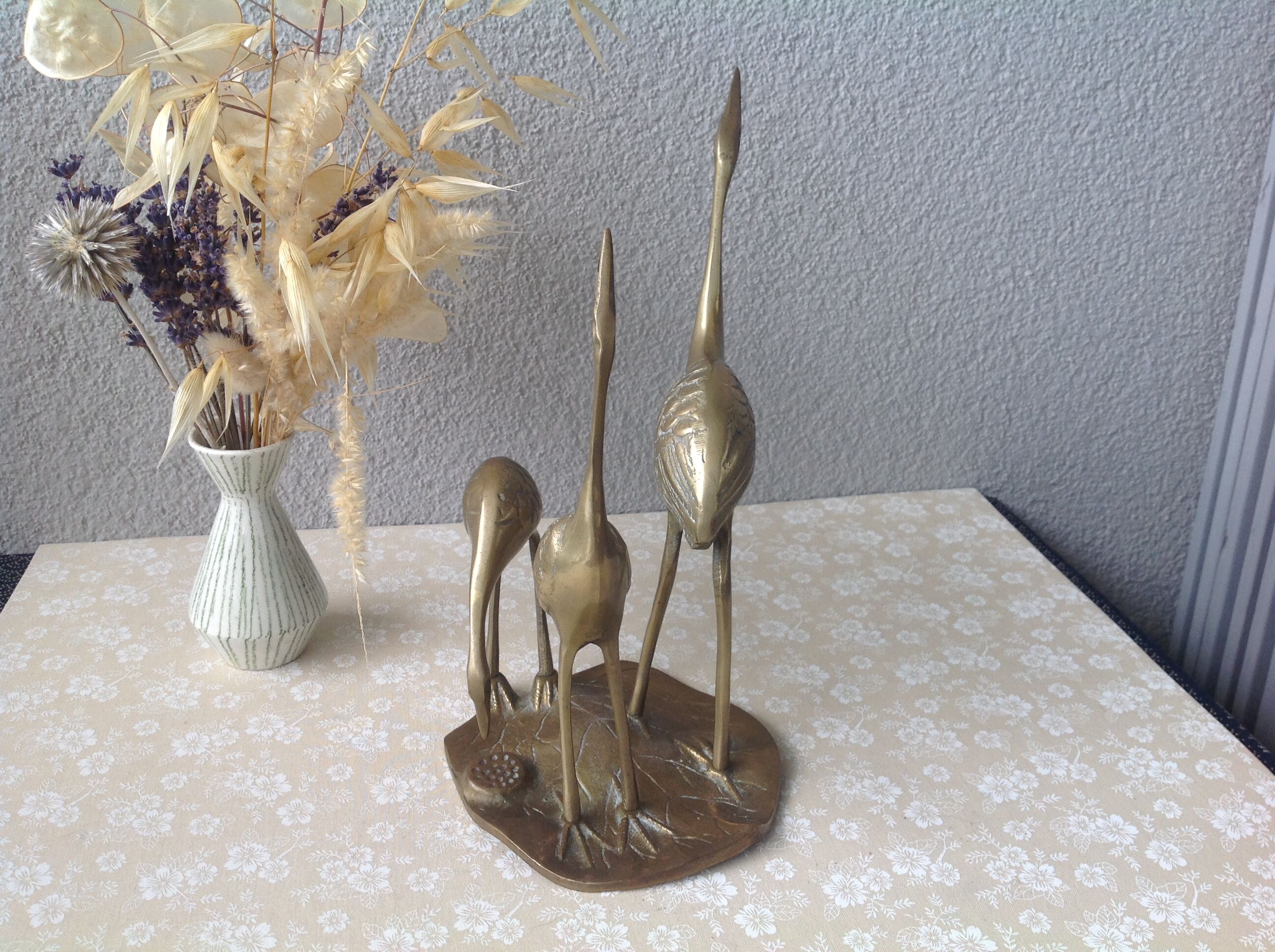 Golden brass herons