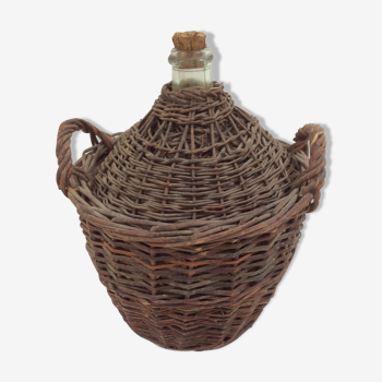 Demijohn in her braided wicker basket