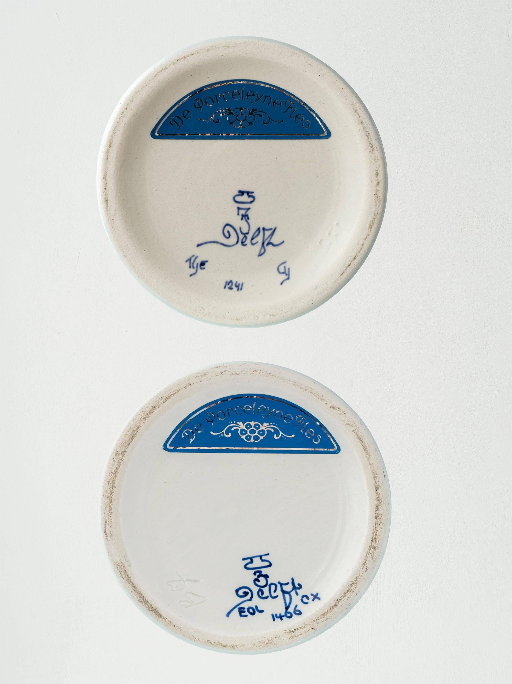 Pair of Chinese table lamps in Delft blue ceramic with new green silk shades.