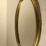 Golden oval mirror