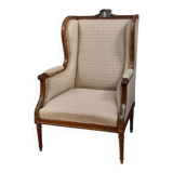 Wingback armchair in walnut, Louis XVI style – late 19th century