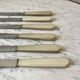 set of 6 white bakelite knives from the 60s