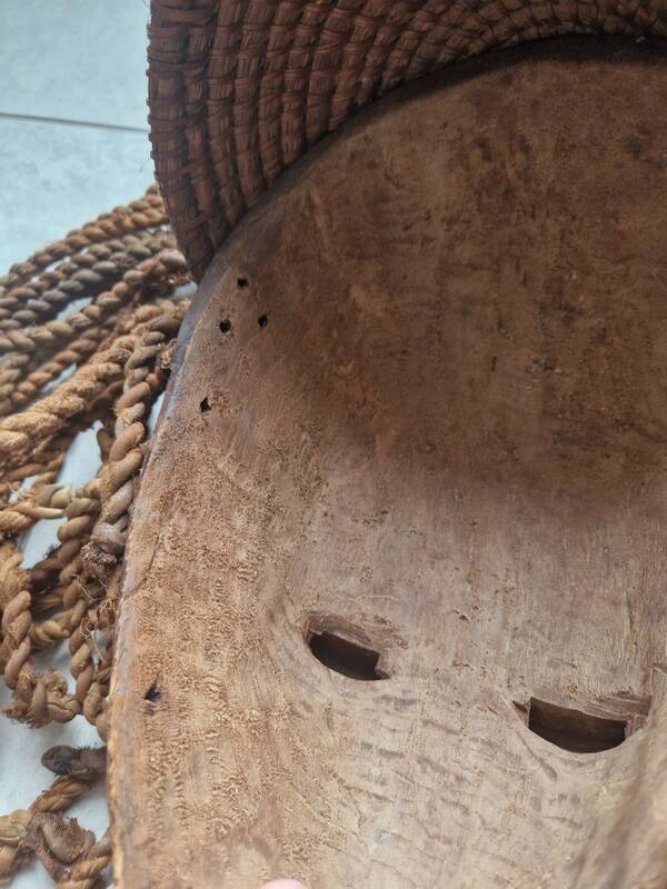 Chokwe Mwana Pwo mask in carved wood with a dark patina and rope hair