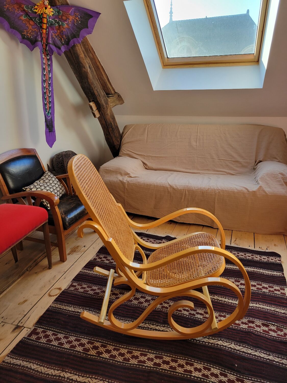 Rocking chair in arched wood and cane