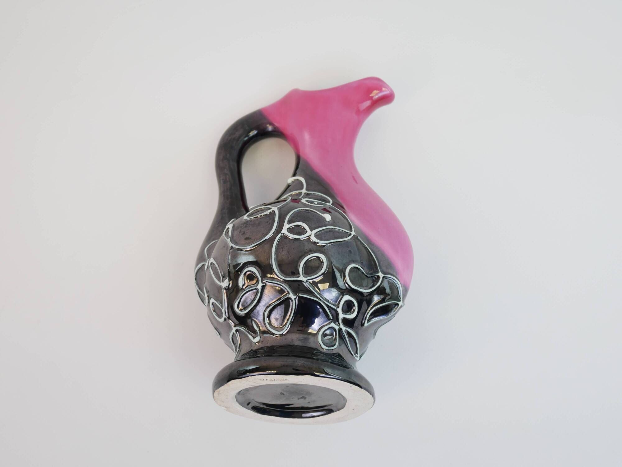 Black and pink Vallauris carafe with white relief patterns