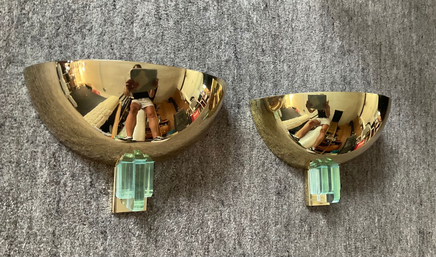 Pair of Hollywood Regency half-moon wall lamps in gilded metal and plexiglass