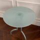Metal and glass tripod pedestal table