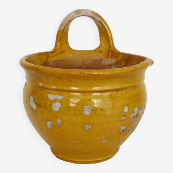 Old yellow glazed terracotta pot. Popular art, peasant art. 1920s