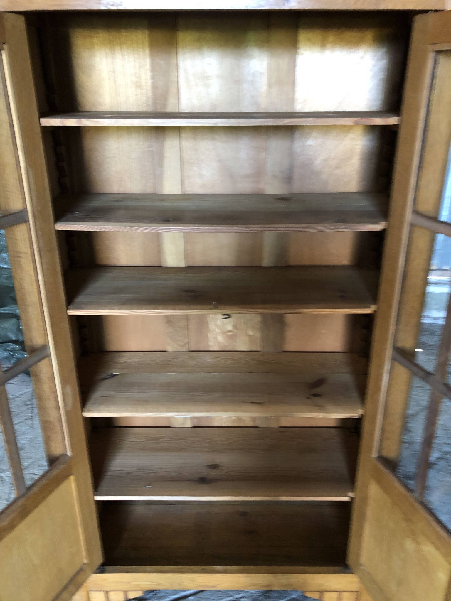 Vintage oak bookcase from the reconstruction period with 2 doors with small panes.
