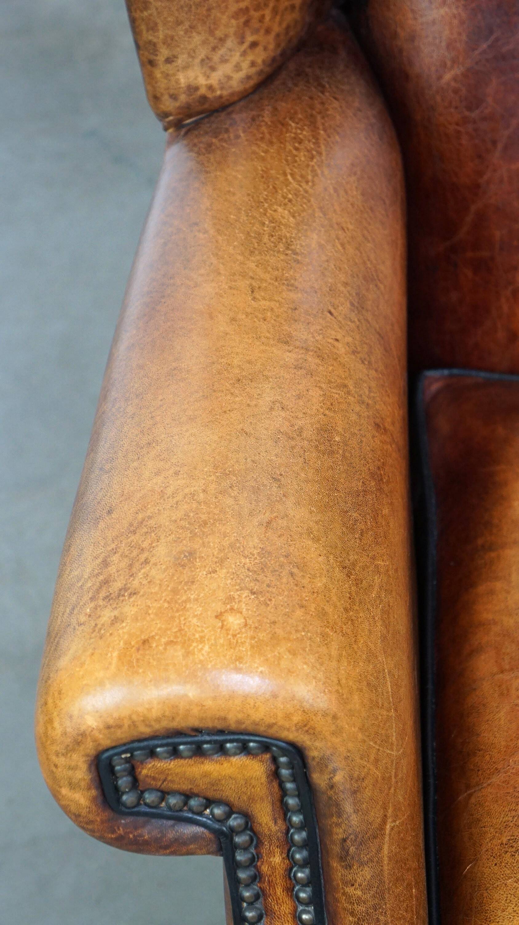 Sheepskin leather chair with a beautiful patina