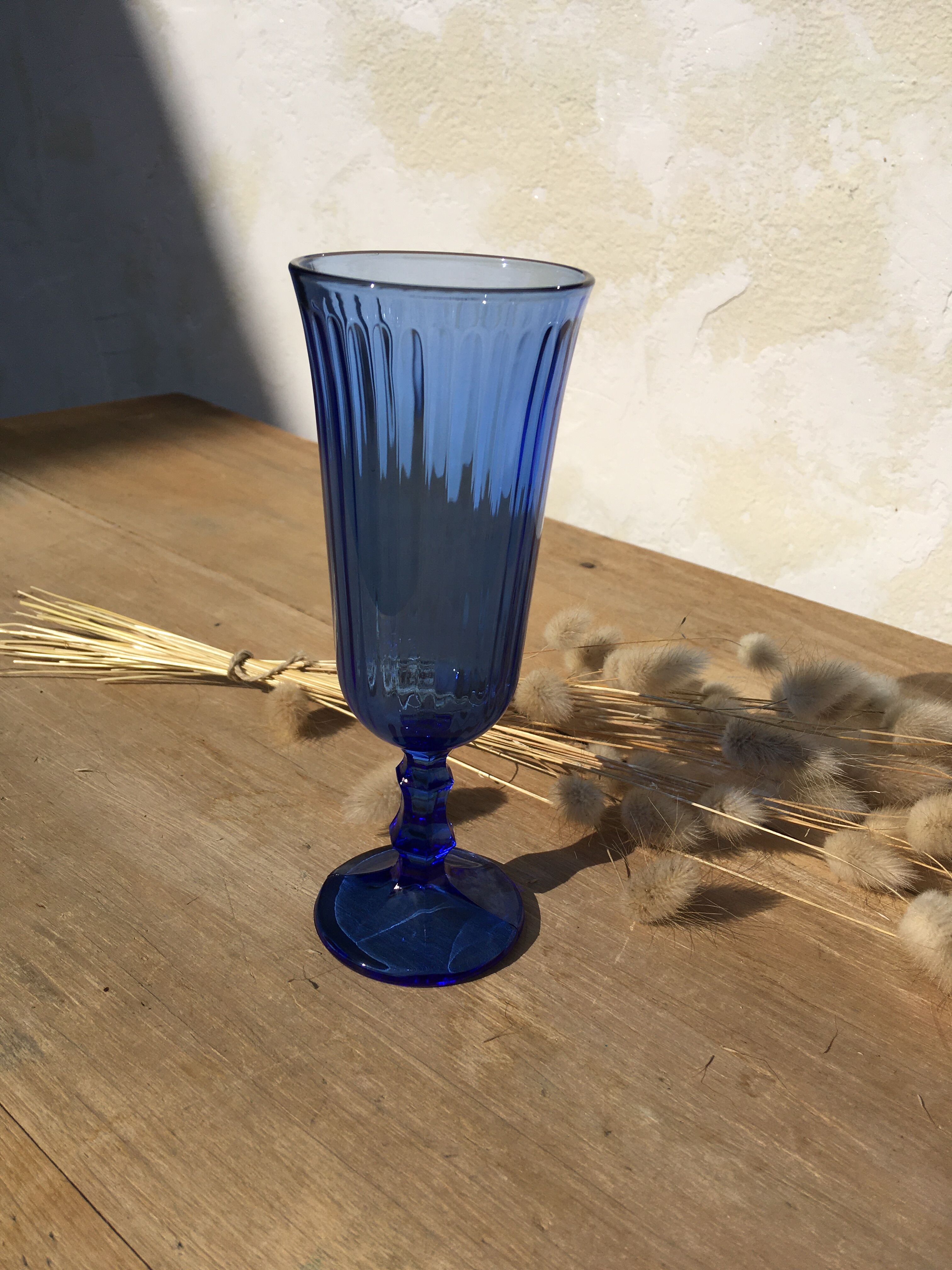 Champagne flutes in blue glass