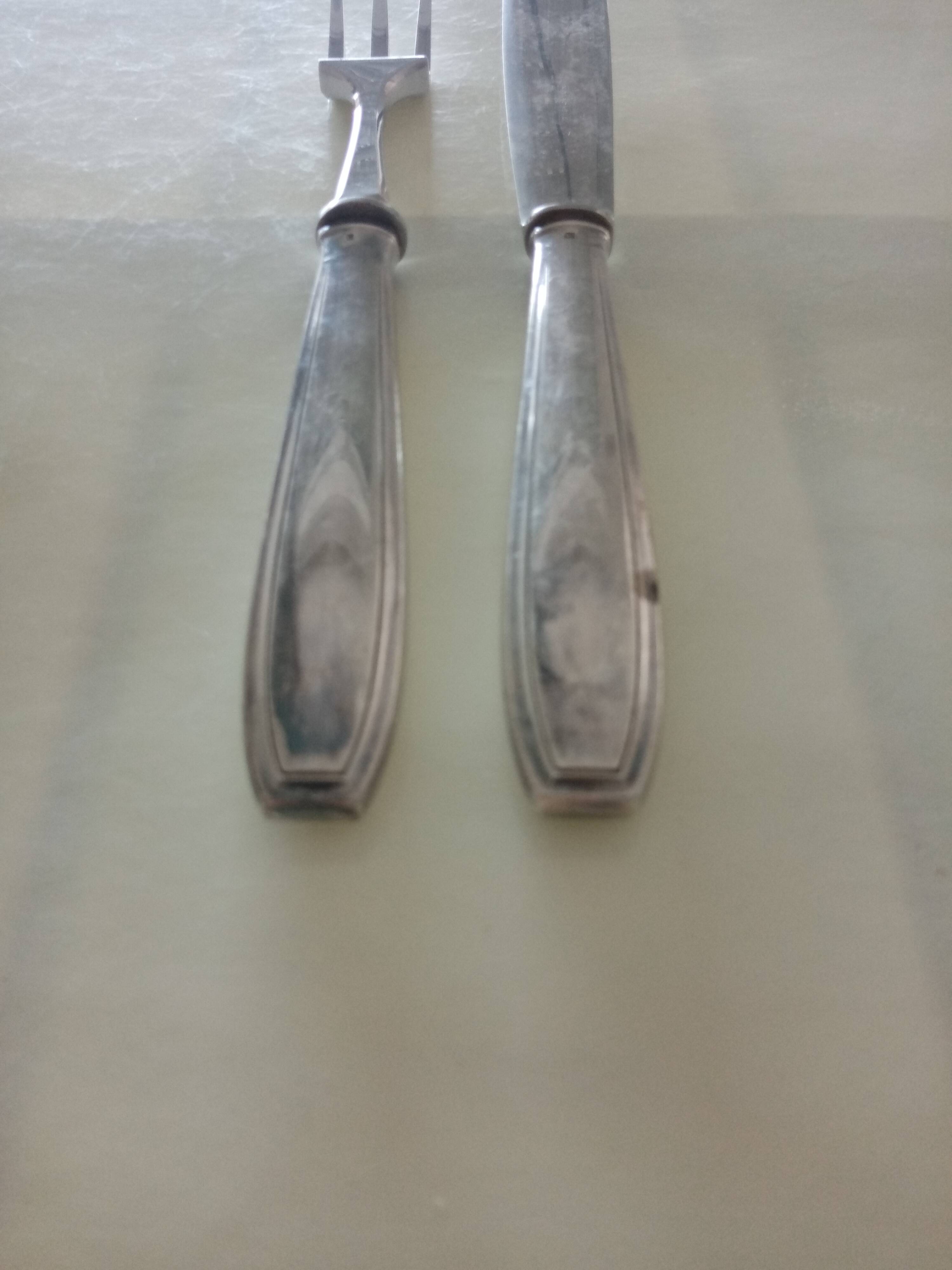 Serving cutlery in silver metal