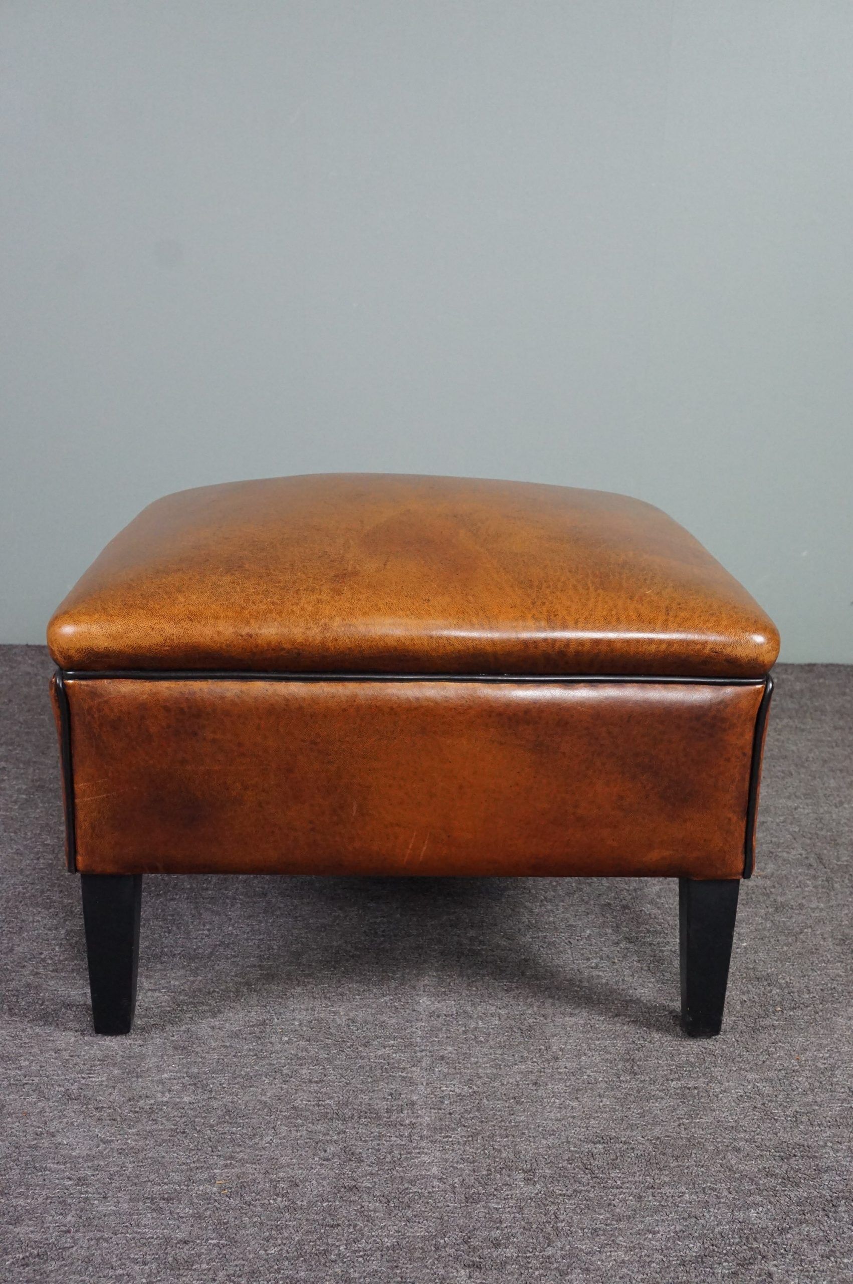 Schapenleren armchair and studio lounge stool