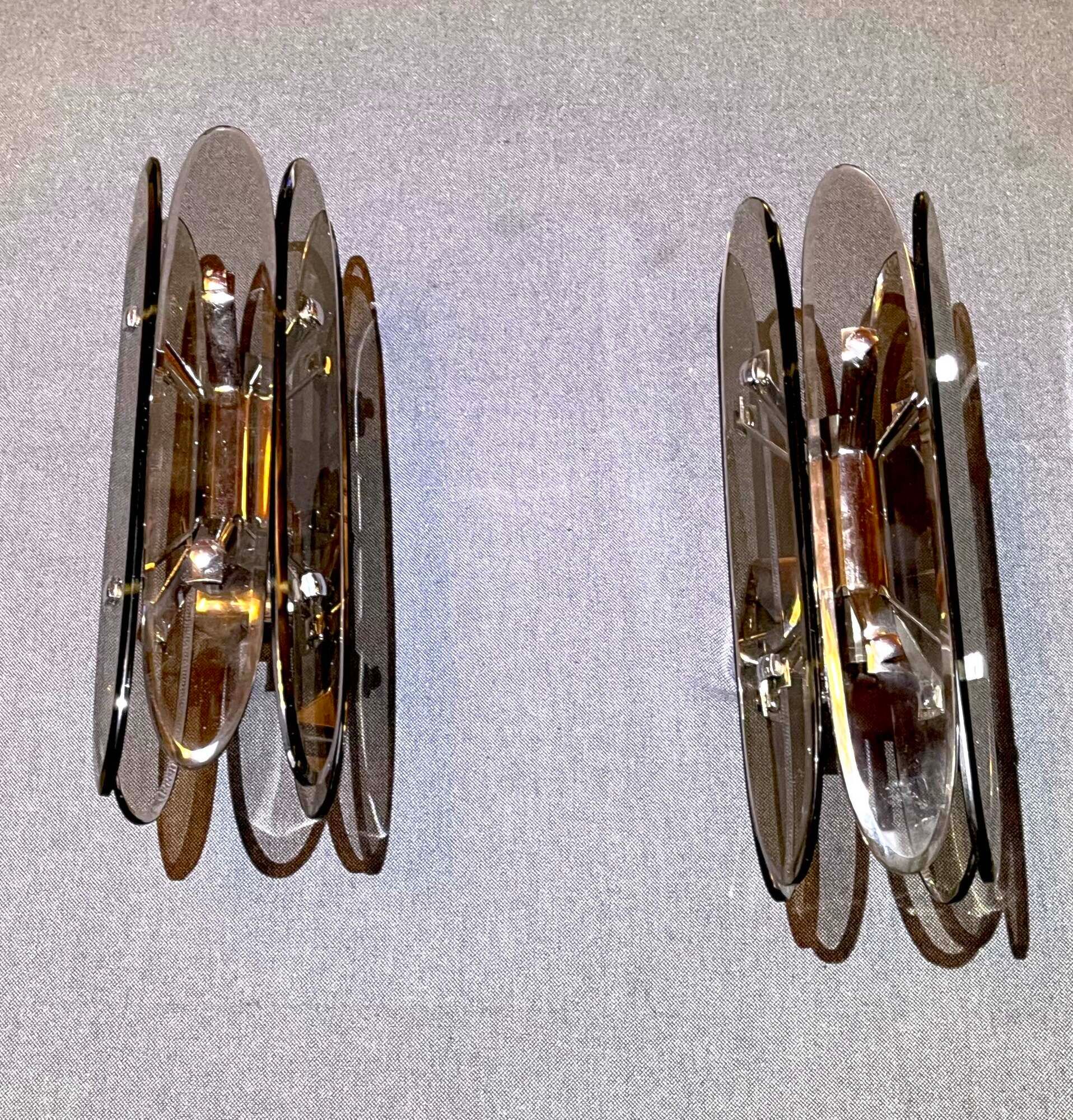 Pair of Italian wall lamp in glass and chrome, 1970's