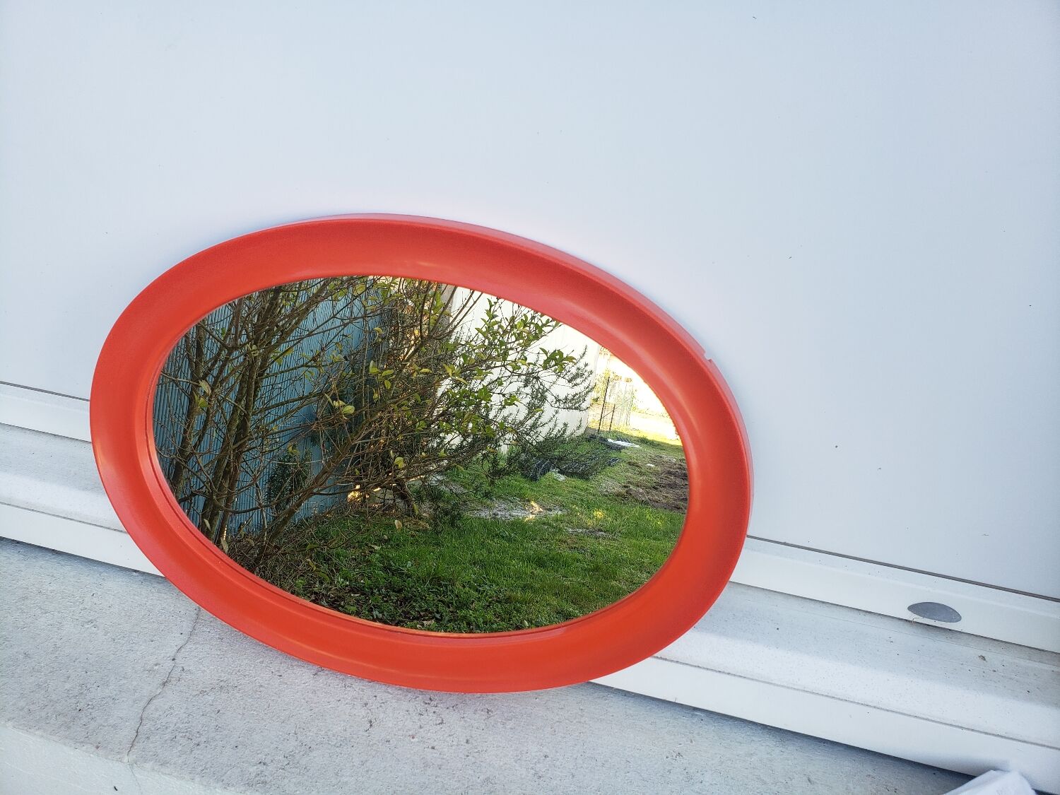Orange oval mirror 1970 seventie