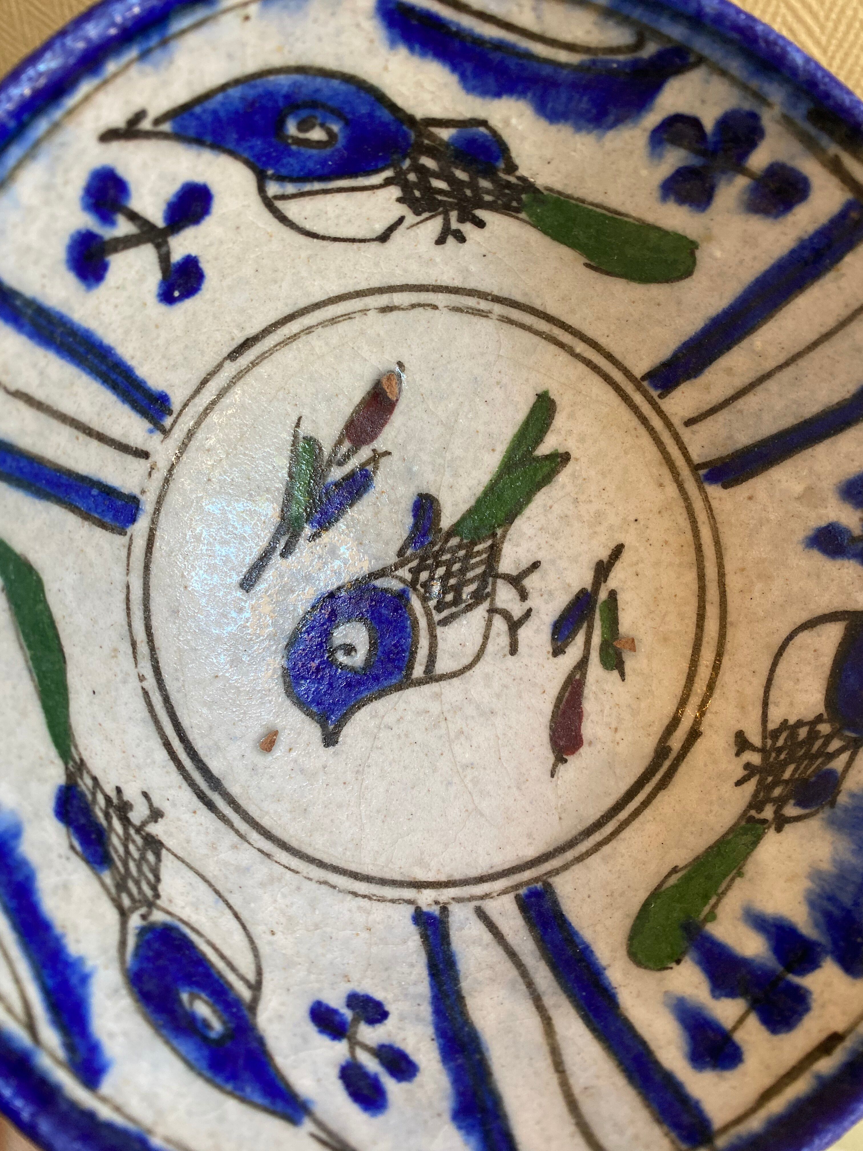 Ancient Persian ceramic bowl in Qajar style.