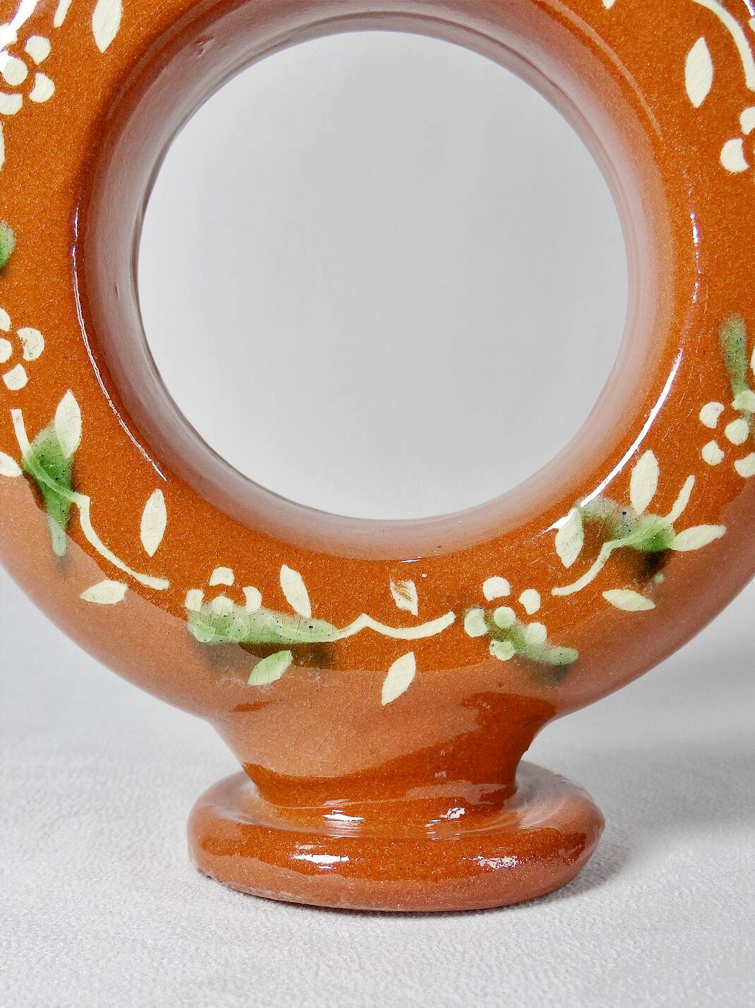 Circular glazed terracotta gargoulette