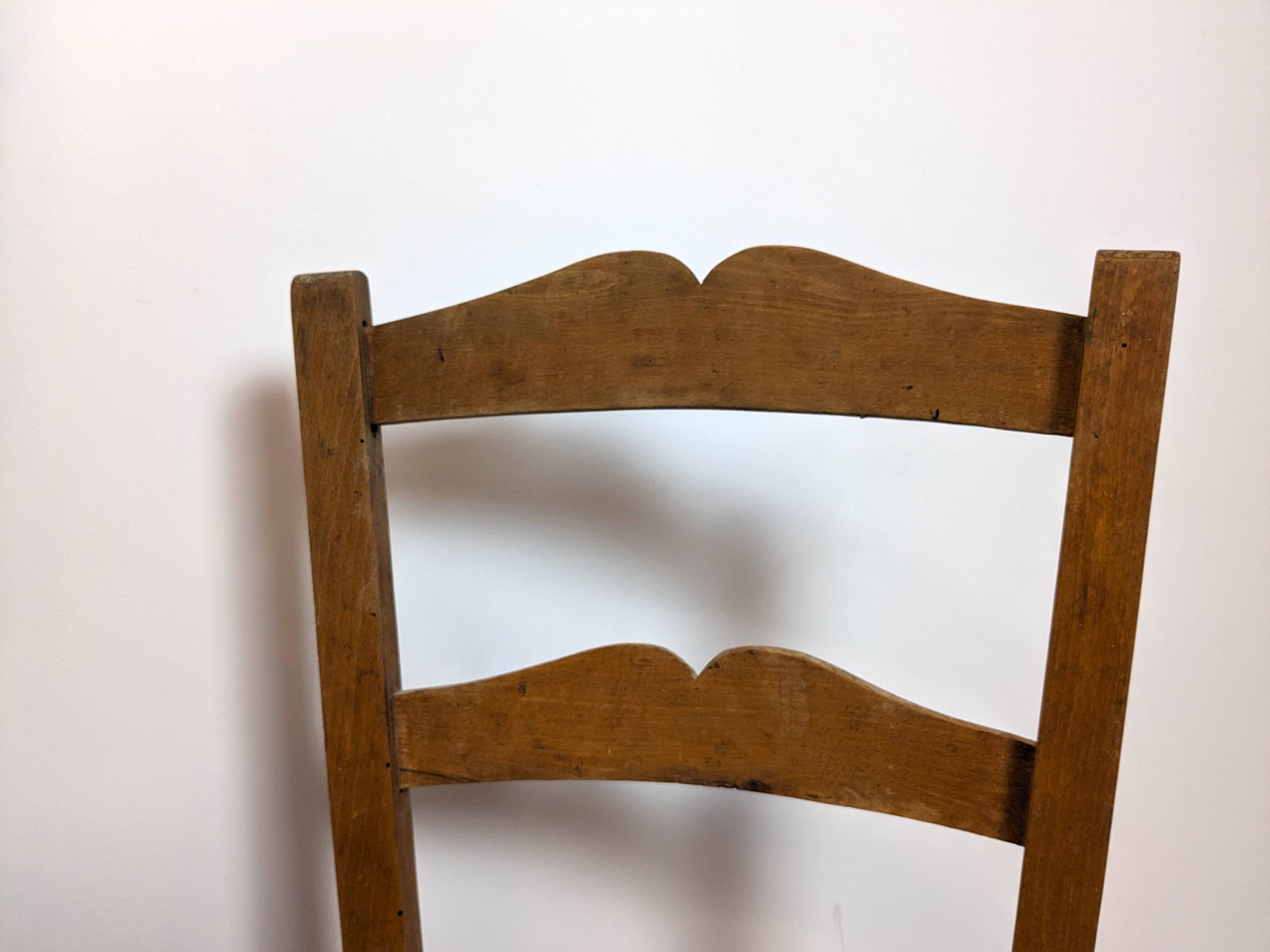 Vintage wooden and straw children's chair in a country style.