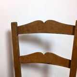 Vintage wooden and straw children's chair in a country style.