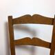 Vintage wooden and straw children's chair in a country style.