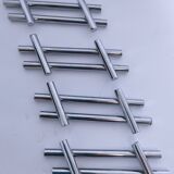 Twelve 70s design metal knife holders