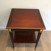 Two-level table in mahogany and brass