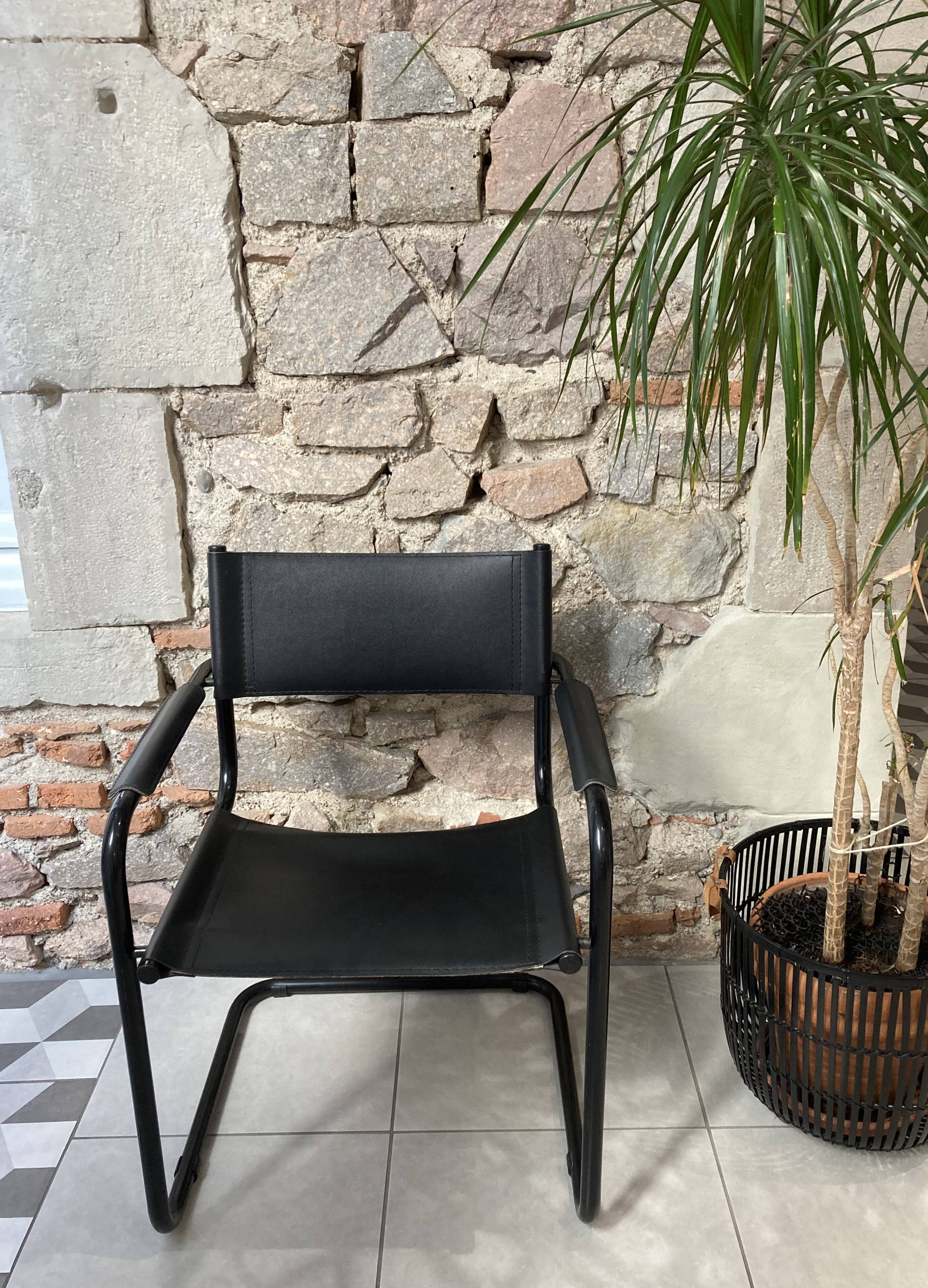 Armchair in black lacquered metal