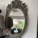 Miroir ovale biseaute  en bois et stuc