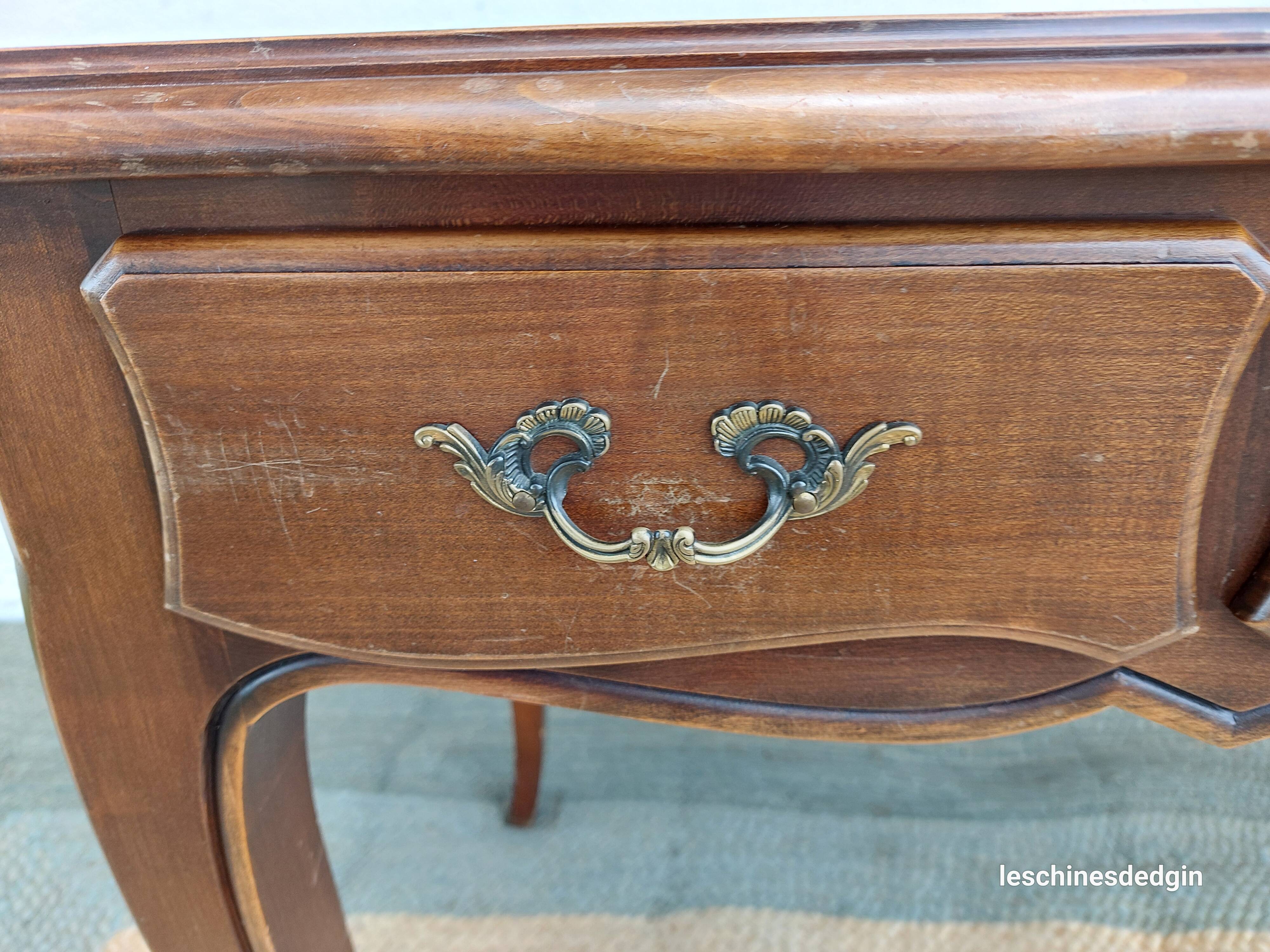Louis XV style desk in wood, with a brown leather top.