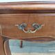 Louis XV style desk in wood, with a brown leather top.