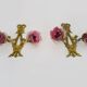 Paire d'Appliques murales en bronze à décor de noeuds à 2 bras à tulipe mauve Signées DP. Années 40