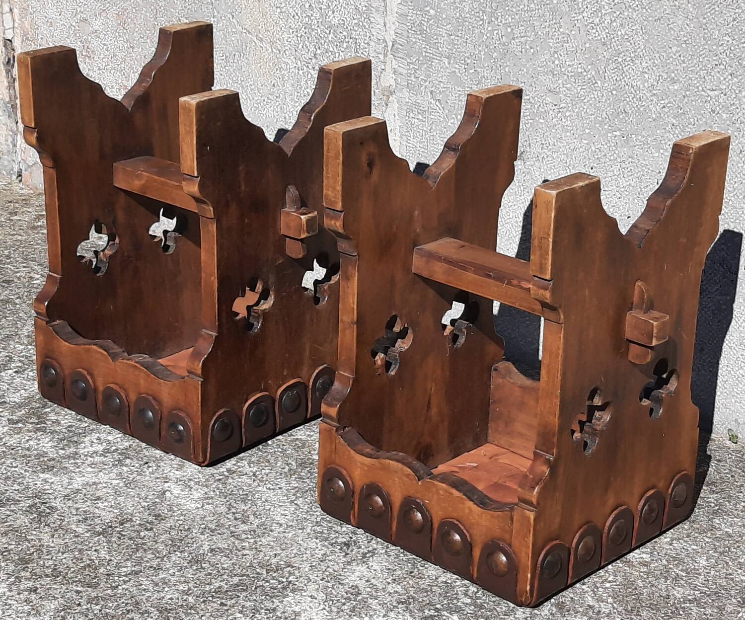 Pair of brutalist stools, leather seat.