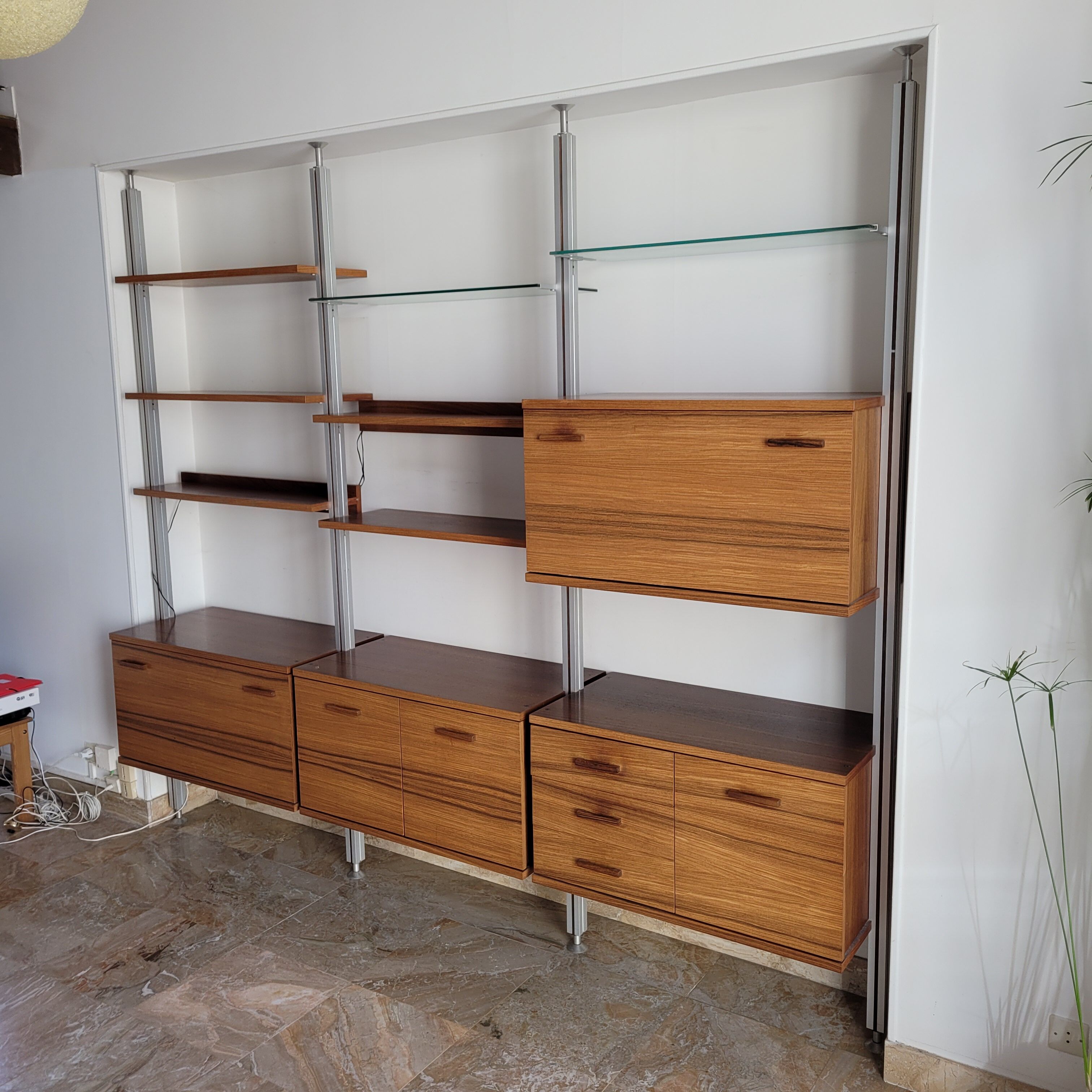 Large Scandinavian wall-mounted wood and aluminum bookcase circa 1960