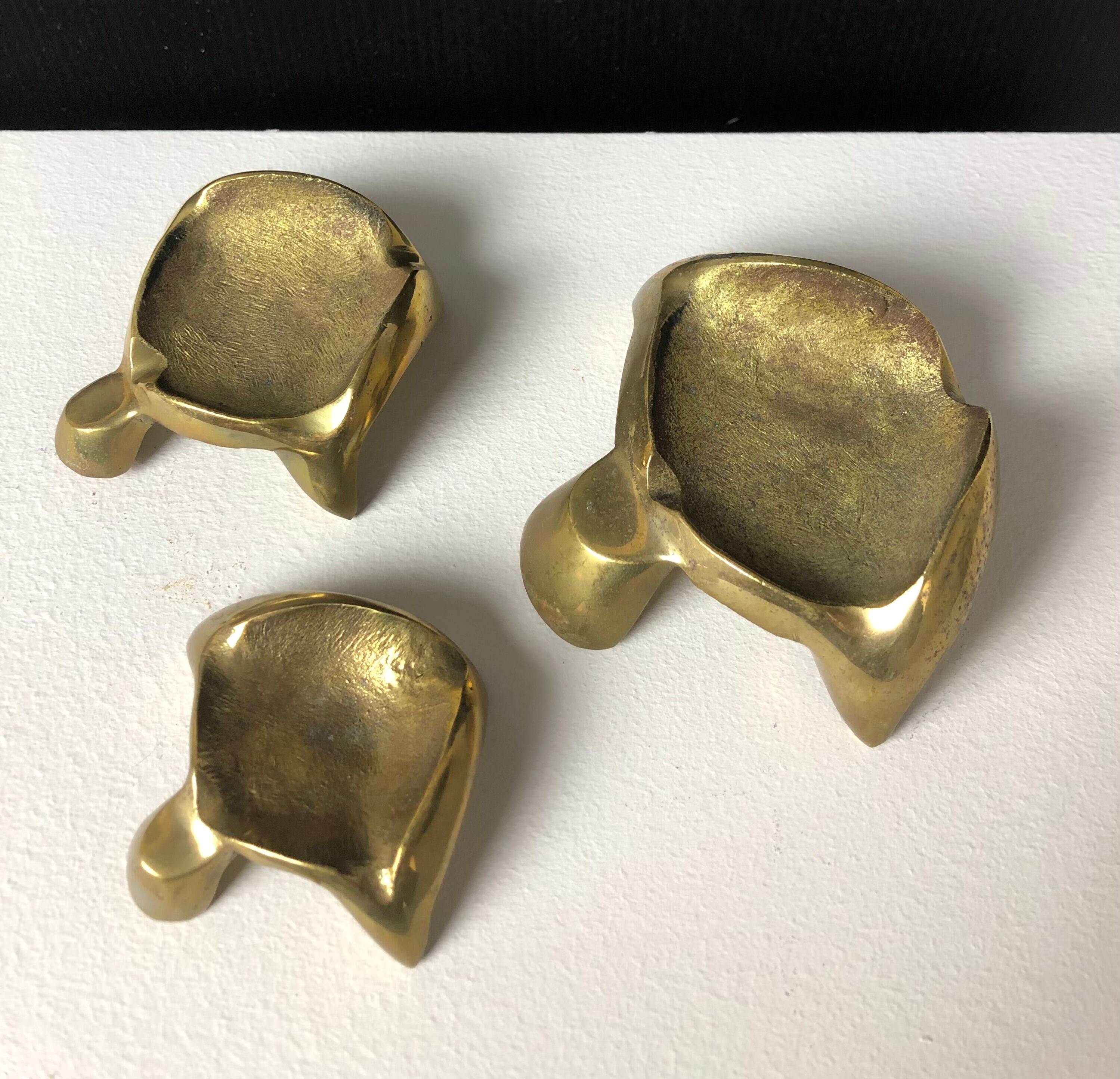 Suite of three bronze "ray"