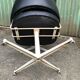 Pair of vintage armchairs in black skai with metal legs.