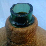 Demijohn dressed in burlap and padded cork