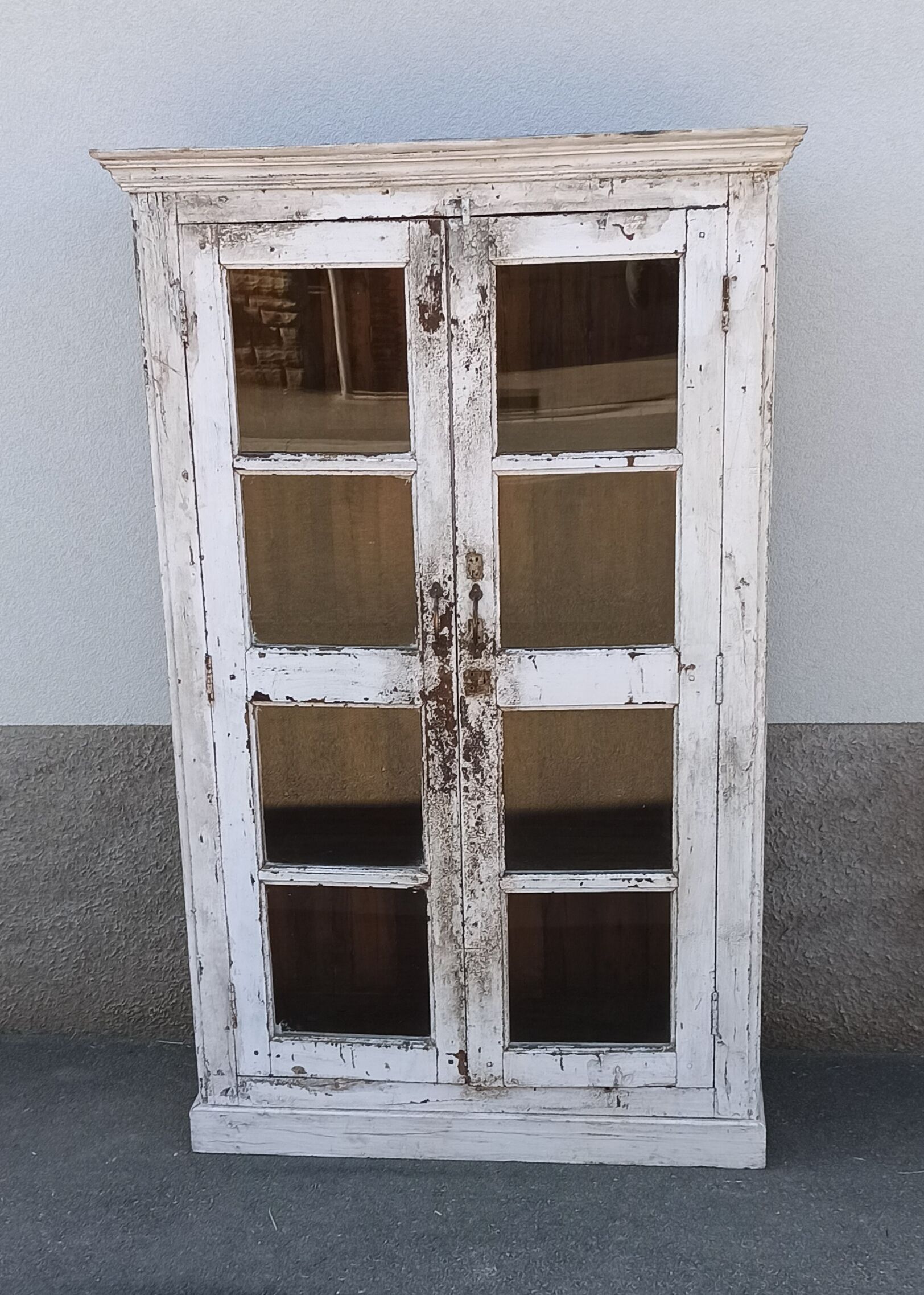 White wooden antique glazed wardrobe