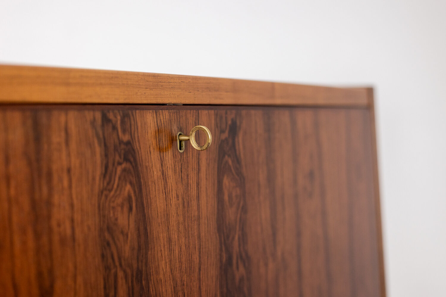 Rosewood chest of drawers with 2 drawers, forming a secretary. 1970s.