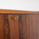 Rosewood chest of drawers with 2 drawers, forming a secretary. 1970s.