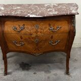 Curved and inlaid Louis XV style chest of drawers