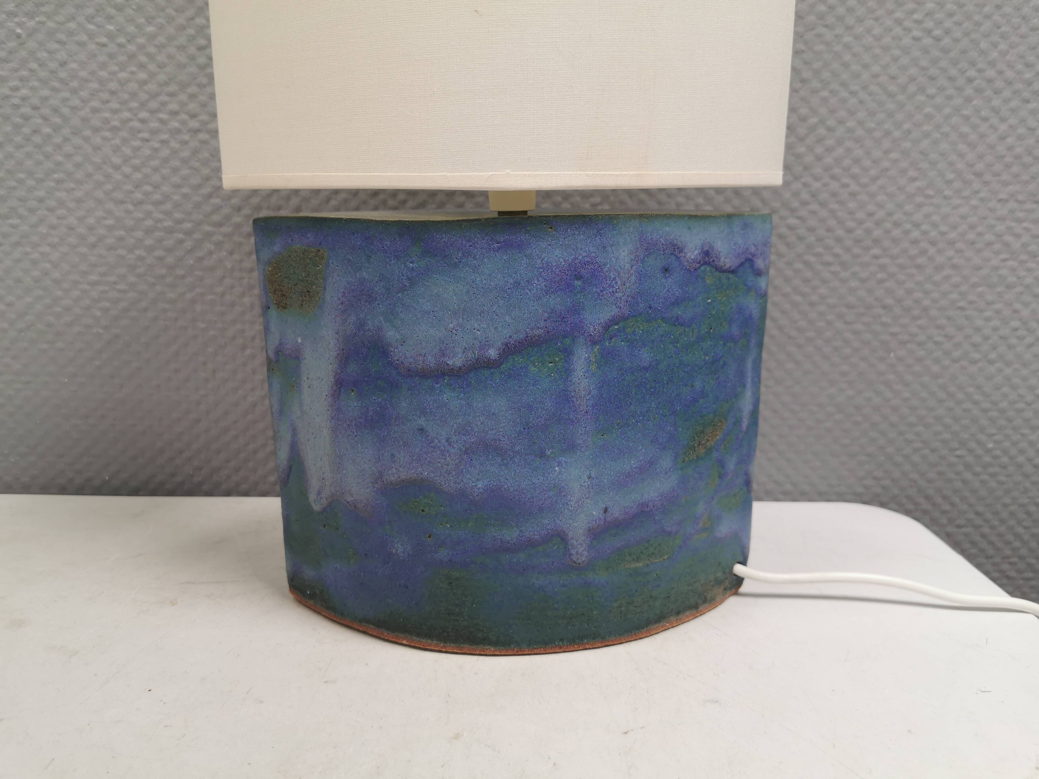 Sculptural table lamp in blue glaze with an abstract expression.