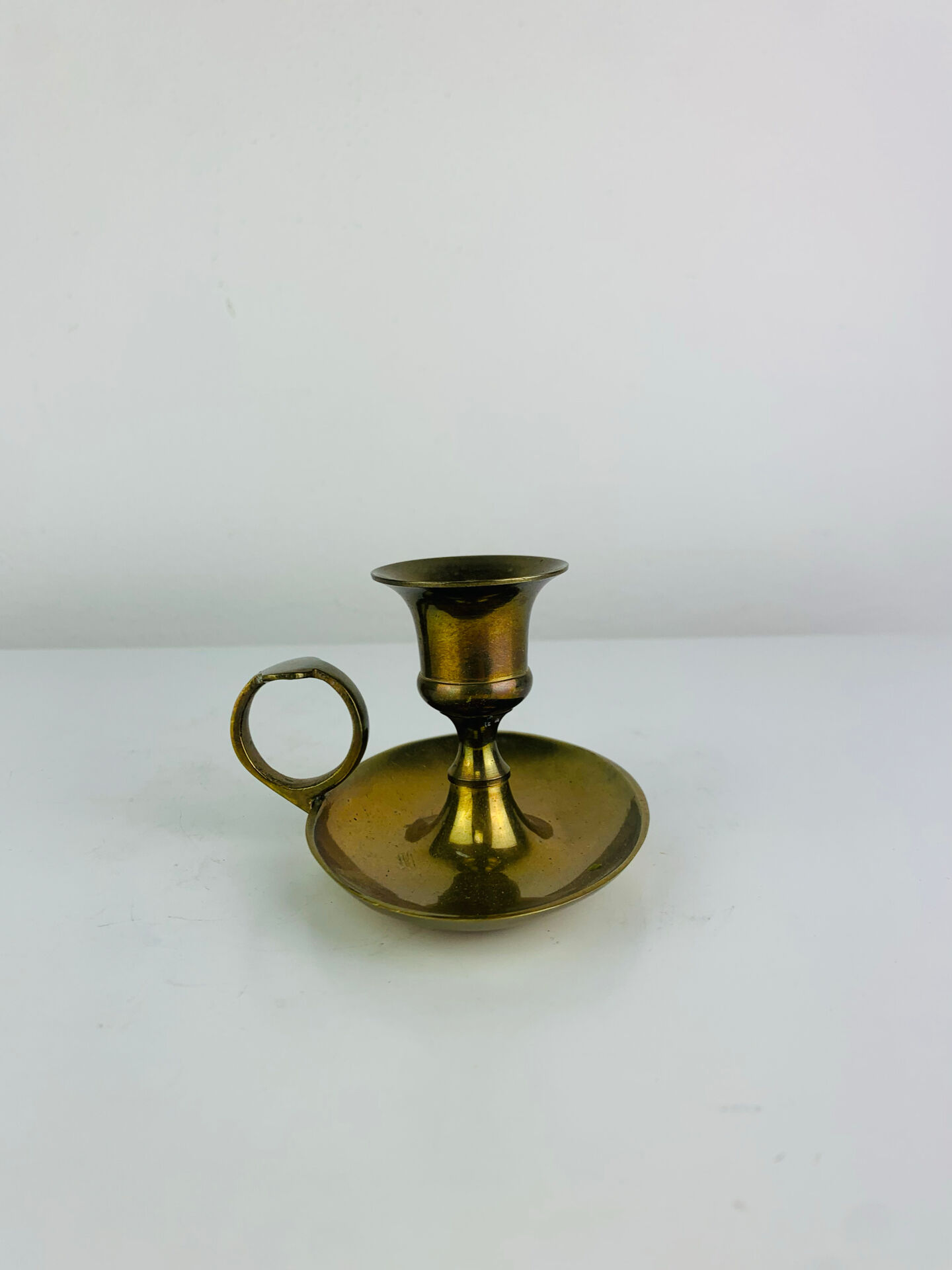 Vintage brass candlestick, rat of the cellar.