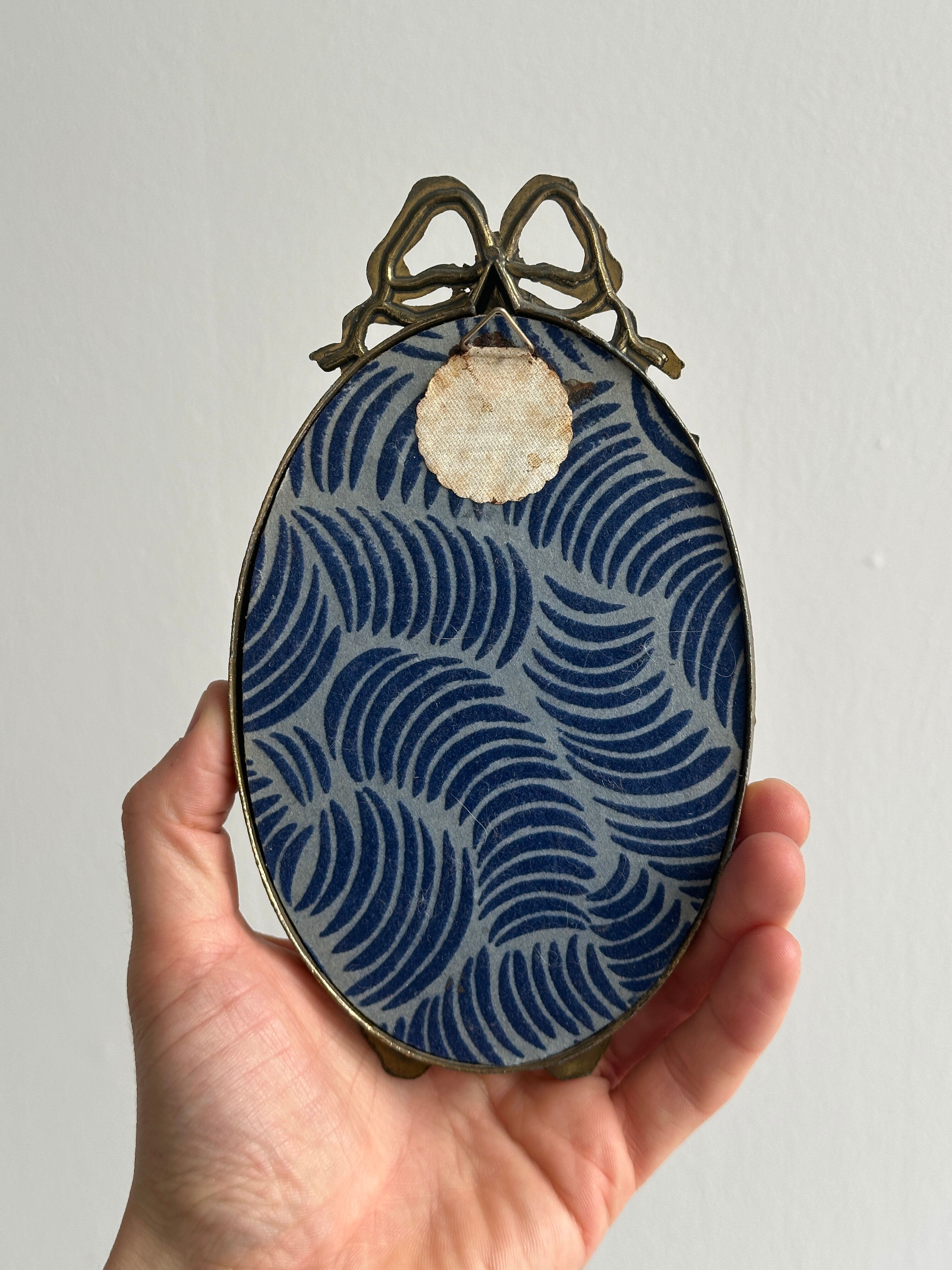 Petit miroir oval ancien