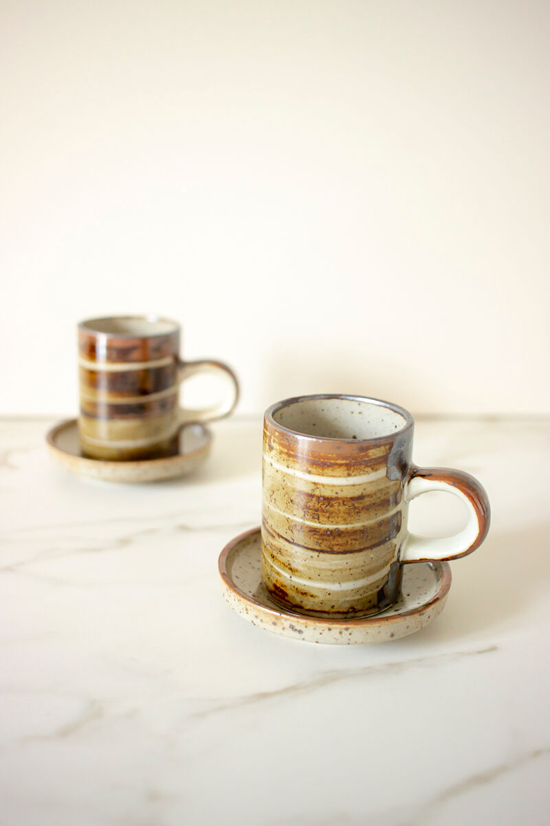 Pair of stoneware cups and sub-cups